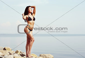young woman in black bikini
