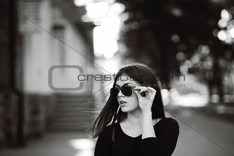 street fashion portrait of a young dark hair girl 