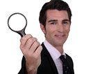 detective holding magnifying glass isolated on whiet