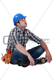 Tired builder taking well earned break