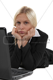 Glum woman with her laptop
