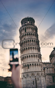 Tourist taking a photo at the Pisa Tower