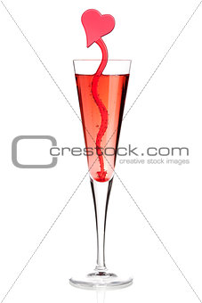 Red champagne alcohol cocktail with heart decoration