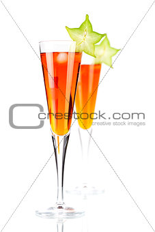 Orange alcohol cocktail with carambola