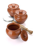 Three clay pots and holder