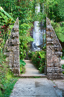 Traditional double stone gate on waterfall