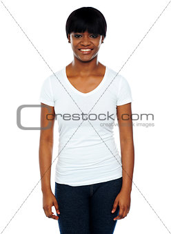 Happy young african woman standing