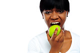 Close up shot pretty lady eating green apple