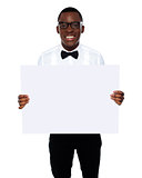 Smiling business representative holding whiteboard