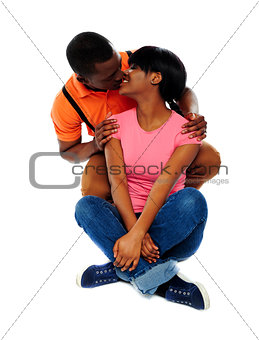 Smiling young couple about to kiss