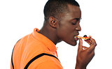 Young man eating a slice of pizza