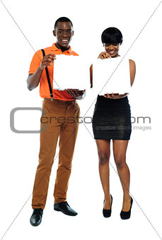 Attractive african couple with pizza boxes