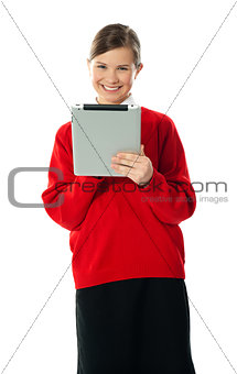 Confident girl using wireless portable device