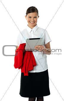 Pretty teenager posing with wireless tablet pc