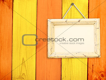 Wooden frame on wooden wall 