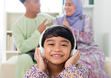 Muslim girl listening to song