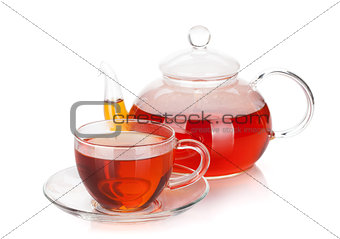 Glass cup and teapot of black tea