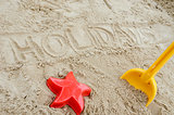 Holidays written in sand
