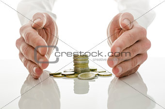Male hands around Euro coins