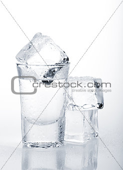 Vodka shot with ice cubes