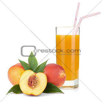 Peach juice in a glass and fresh peaches