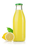 Bottle of lemon juice and fresh lemons