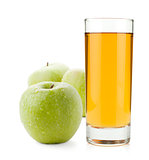 Apple juice in glass and green apples