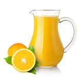 Orange juice in pitcher and oranges