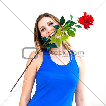 woman holding red rose in her mouth