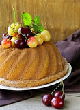 round sponge cake with berries cherry