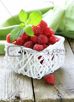 ripe fresh organic raspberries in the basket