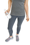 Closeup on fitness young woman with bottle of water