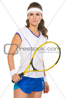 Portrait of serious female tennis player