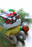 Christmas composition - a wooden sleigh with gifts and fir tree  branches