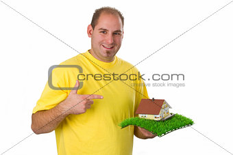 Young man with model house