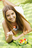 Healthy woman eating salad