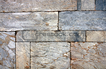 Wall of marble blocks