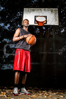 Basketball player on the outdoor basketball court.