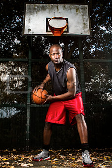 Basketball player on the outdoor basketball court.