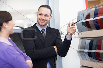 Salesman showing a color palette to a woman