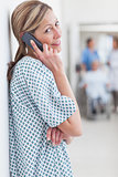 Female patient phoning in a hospital