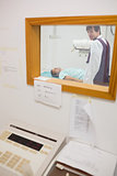 View of doctor doing a radiography through a window