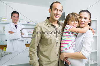 Smiling family and a pharmacist