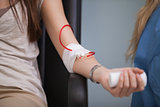 Young woman giving her blood