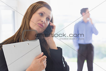 Estate agent looking disappointed on the phone