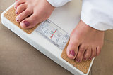 Womans feet on scales
