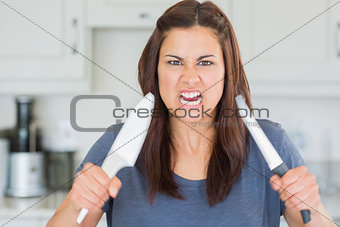 Angry woman holding up knives