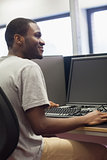 Man sitting at computer smiling