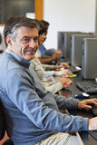 Man sitting at the computer and smiling