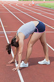 Woman stretching on the track